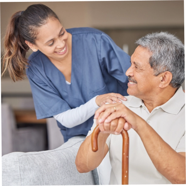 A female caregiver and an elderly man sitting