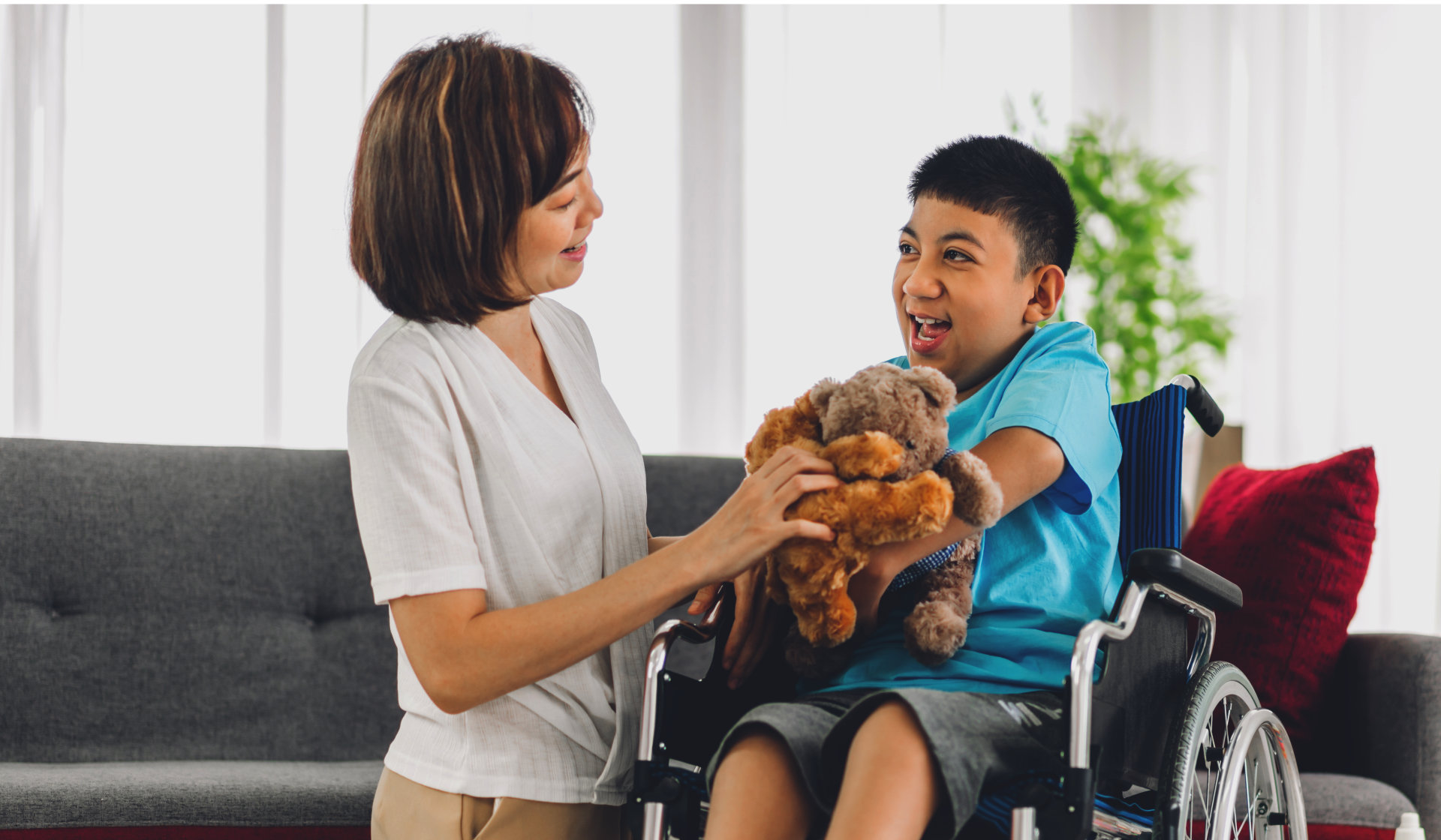 A female caregiver and a child with special need sittin on a wheelchair